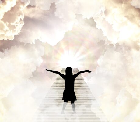 figure with arms wide standing at bottom of stairs welcoming divine light